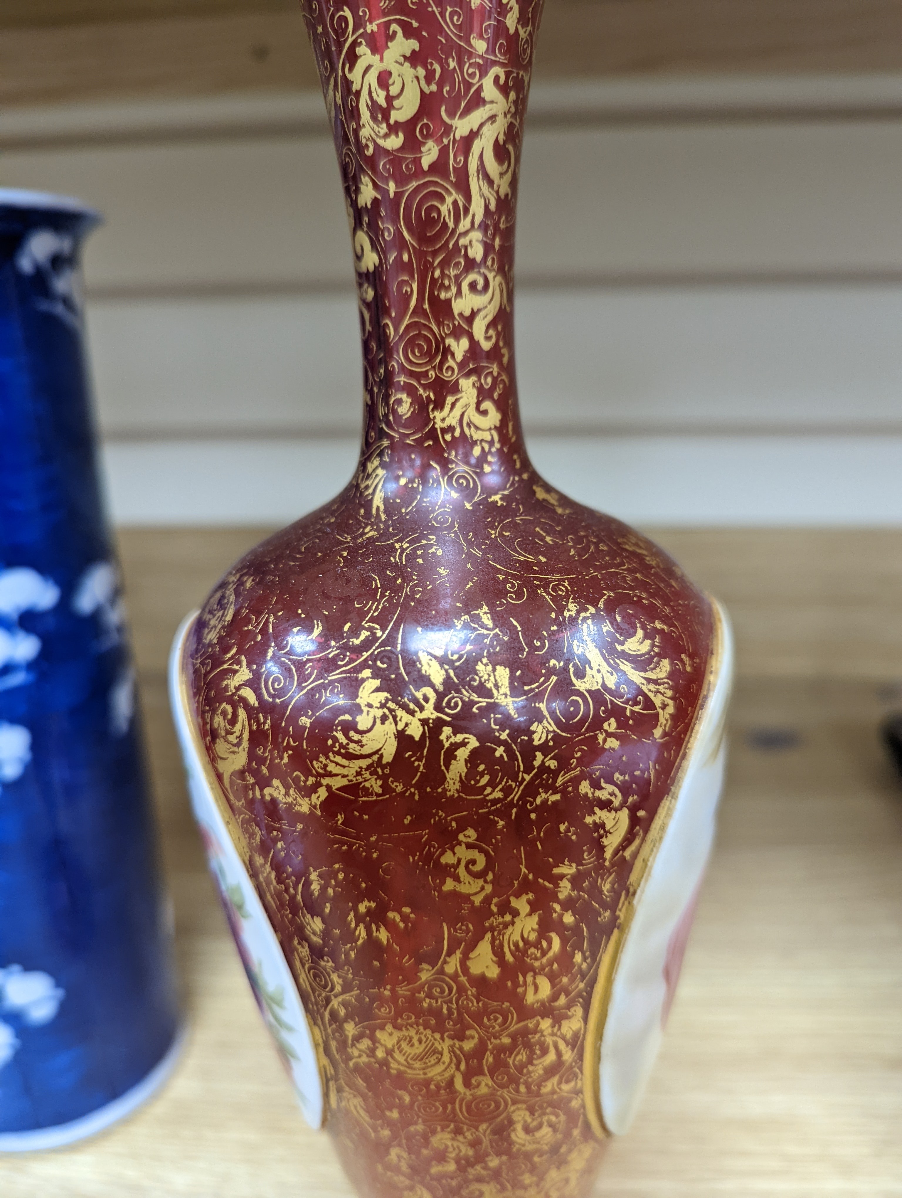 A pair of 19th century Bohemian enamelled and overlaid ruby glass vases 36cm